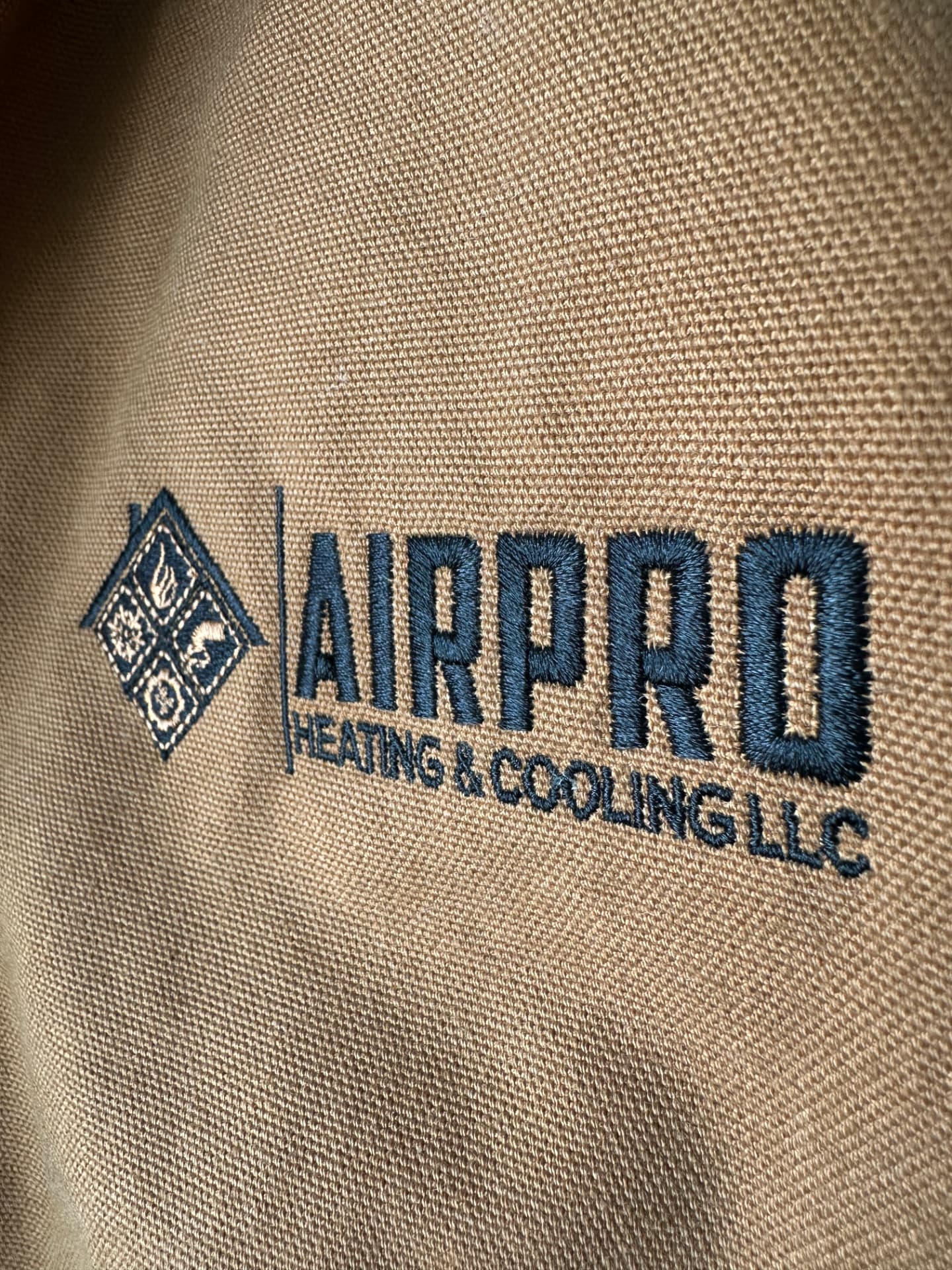 Close-up of high-quality embroidery on a work jacket by Dava X