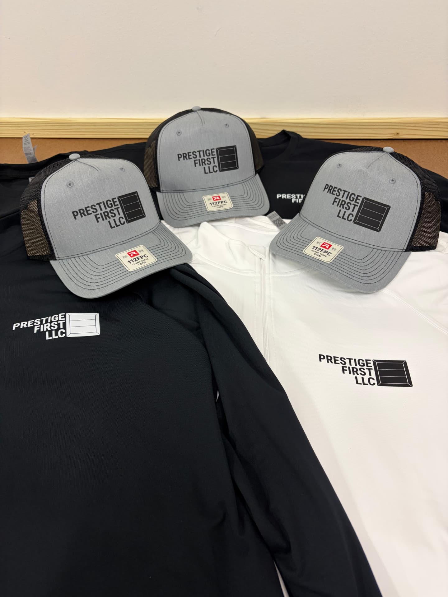 Custom branded caps and long sleeve shirts by Dava X