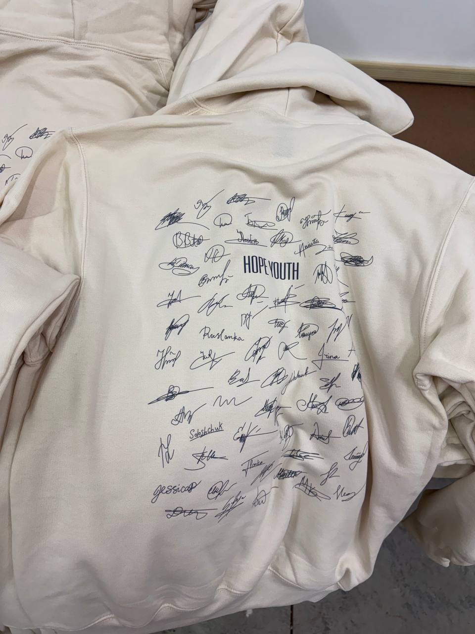 Full-back printed signature hoodie by Dava X